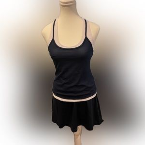 Head Women's skort ;Ativa mesh shirt with white undershirt.